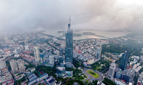 High angle view of city against cloudy sky