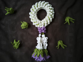 Directly above shot of flowers and leaves on table