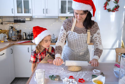 Portrait of smiling family in kitchen