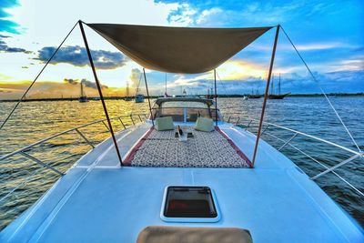 Boat sailing in sea against sky