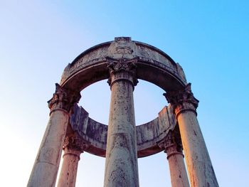 Low angle view of historical building against blue sky