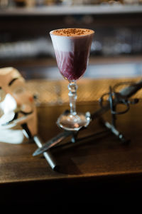 Close-up of wine in glass on table