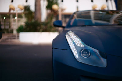 Close-up of car on street