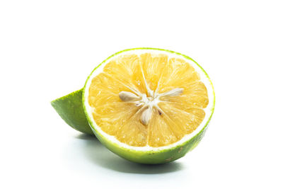 Close-up of lemon slice against white background