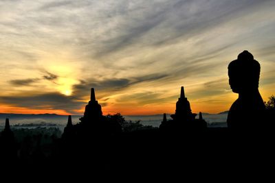 Buddha statue with pagoda in background