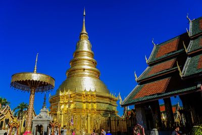 Low angle view of pagoda against buildings