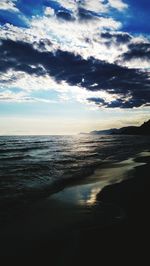 Scenic view of sea against cloudy sky