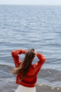 Rear view of woman in sea