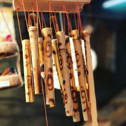 Close-up of chocolate cake hanging on wood