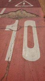 High angle view of arrow sign on road