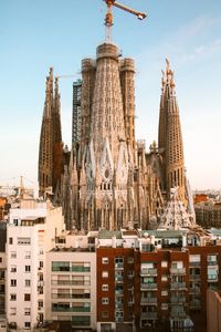 Panoramic view of buildings in city against sky