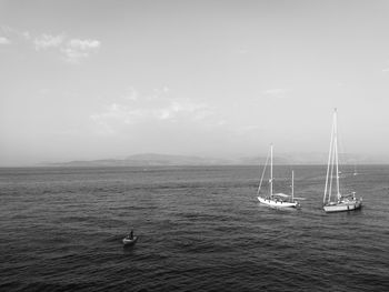 Boat sailing in sea against sky