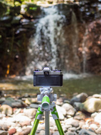 Close-up of camera on rock