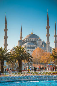 View of cityscape against blue sky