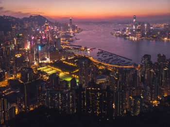 High angle view of illuminated buildings in city at night