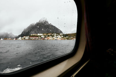 Scenic view of sea seen through glass window