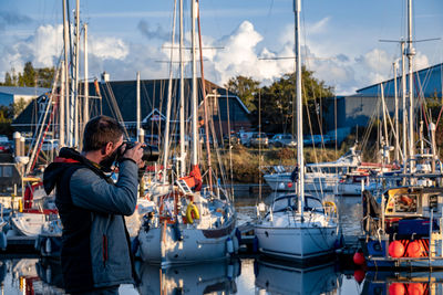 Boats moored at harbor