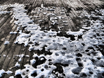 High angle view of snow on boardwalk