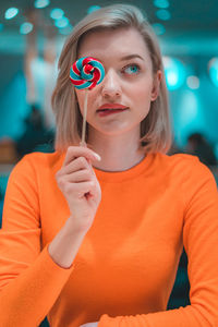 Close-up of woman holding lollipop