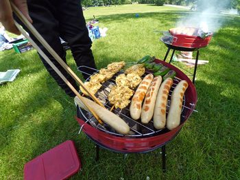 High angle view of meat on barbecue grill