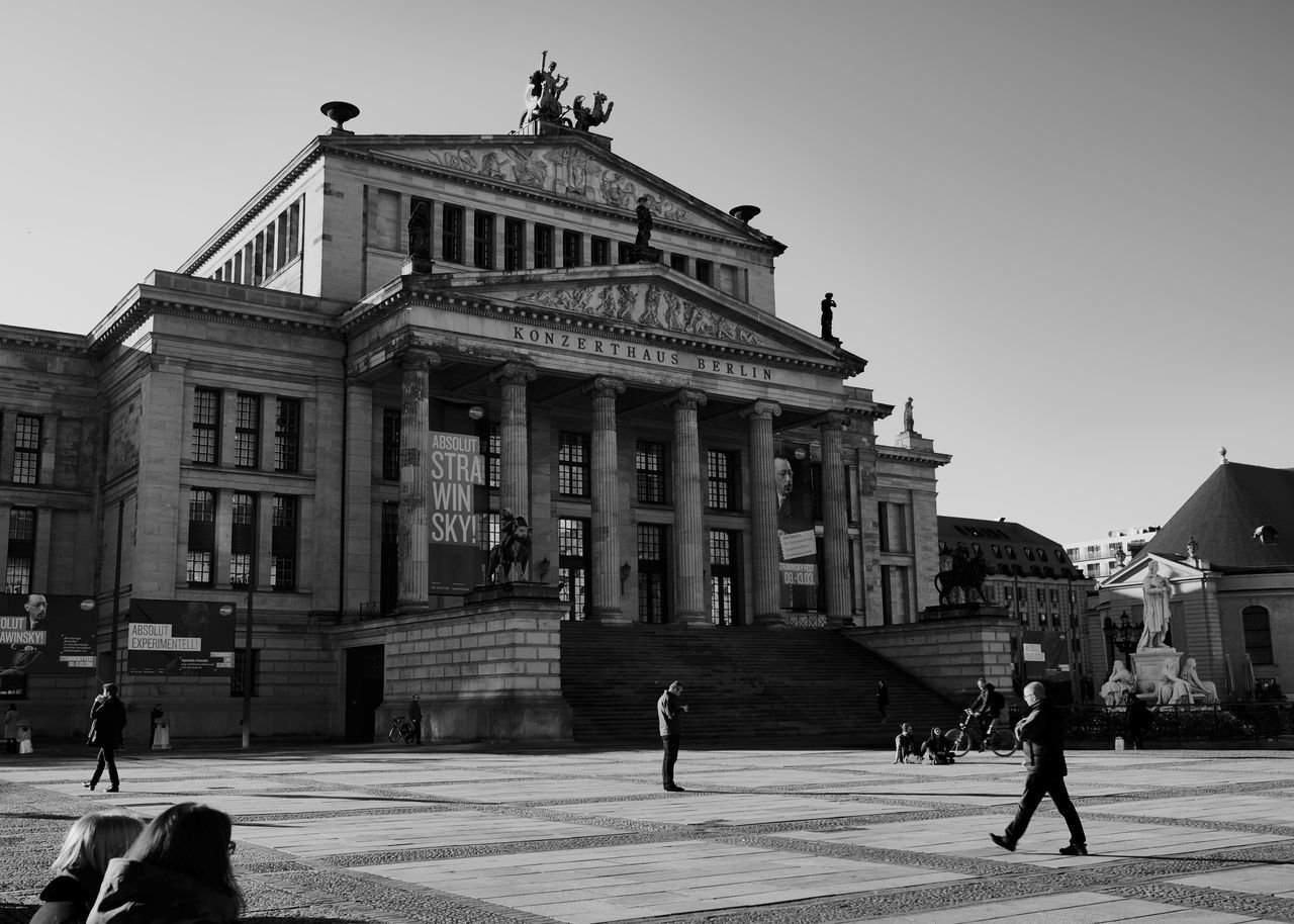 building exterior, architecture, built structure, sky, clear sky, real people, city, group of people, nature, lifestyles, men, travel destinations, incidental people, day, people, building, travel, the past, tourism, architectural column, outdoors