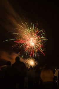 Fireworks with people in foreground, bonfire night