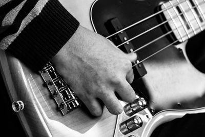 Close-up of man playing guitar