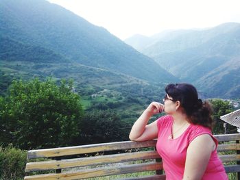 Full length of a young man against mountain range