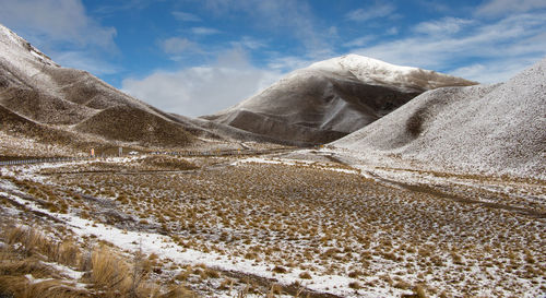 Scenic view of mountains against sky during winter