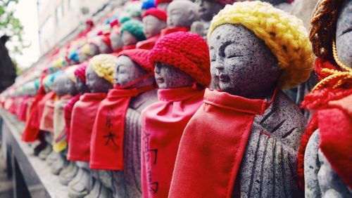 Ksitigarbha bodhisattva statues with knit hats at temple