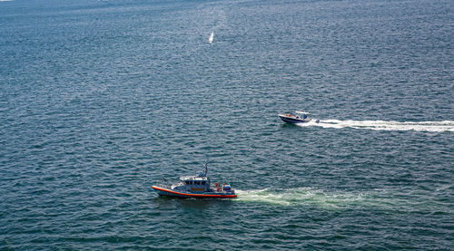 High angle view of sailboat sailing on sea