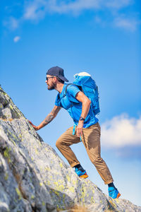 A man on a rest day during a mountain climb