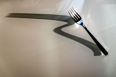 Close-up of fork on white background