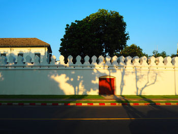 Rear view of people walking on footpath