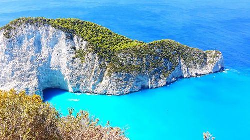 Scenic view of sea against blue sky