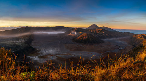 View of volcanic landscape against sky during sunset