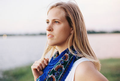 Portrait of beautiful young woman looking away