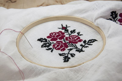 High angle view of embroidery on cloth