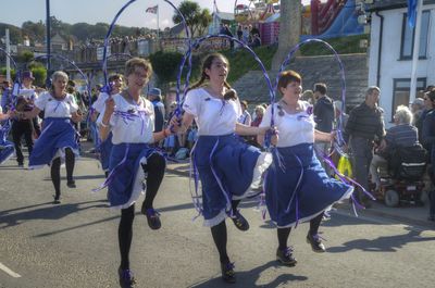 Panoramic view of people dancing at music concert