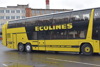 Yellow vintage car on road in city