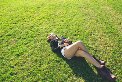 High angle view of woman lying down on land