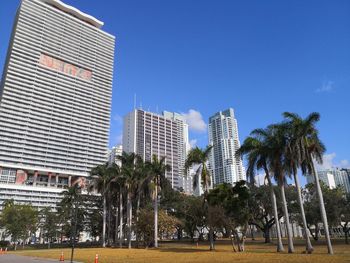 Modern buildings in city against clear sky