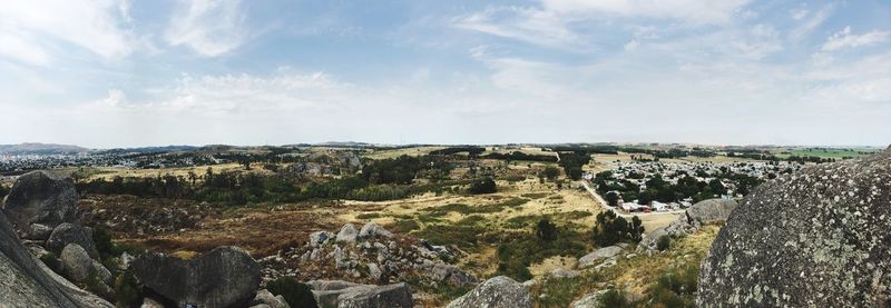 Panoramic view of agricultural landscape against sky