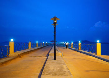 Street lights on footpath at night