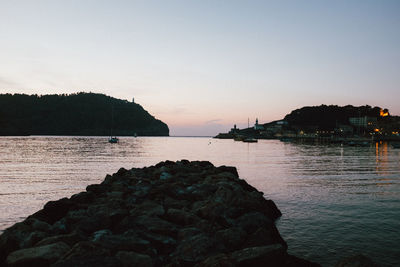 Scenic view of sea against clear sky during sunset