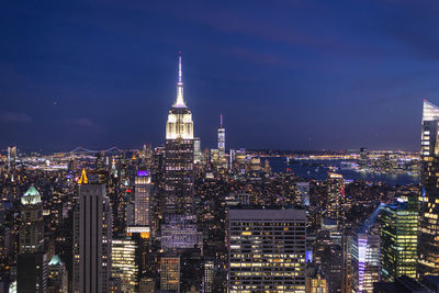 Illuminated buildings in city at night