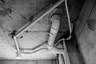 High angle view of abandoned pipe on wall