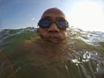 Portrait of man swimming in sea