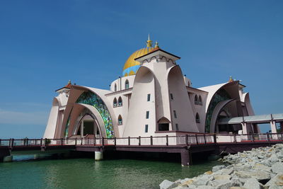 Low angle view of building against clear blue sky