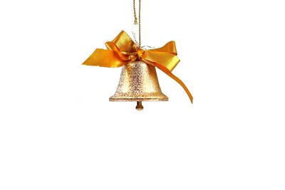 Close-up of christmas decoration hanging against white background